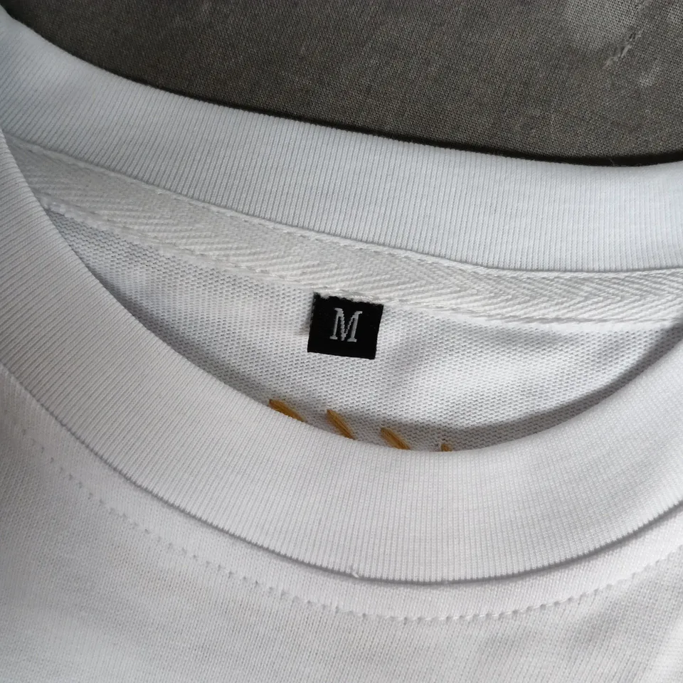 DIRTBAG WHITE T-SHIRT WITH MULTICOLOUR FOOTPRINT PRINT – UK M