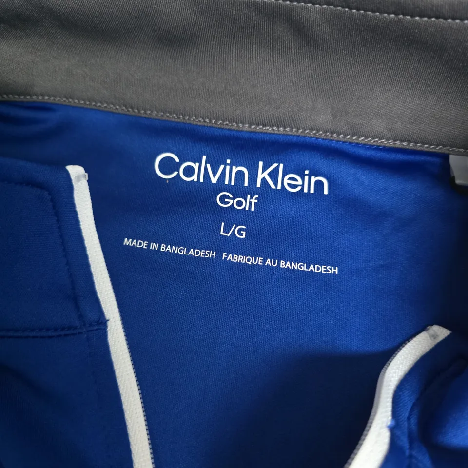 CALVIN KLEIN GOLF BLUE QUARTER ZIP TOP – UK SIZE L (L/G)