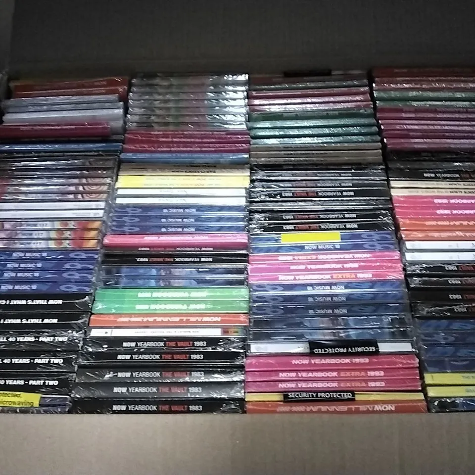 APPROXIMATELY 100 ASSORTED CDS AND DVDS TO INCLUDE NOW MUSIC 18, NOW YEARBOOK, AND NOW THAT'S WHAT I CALL ETC. 