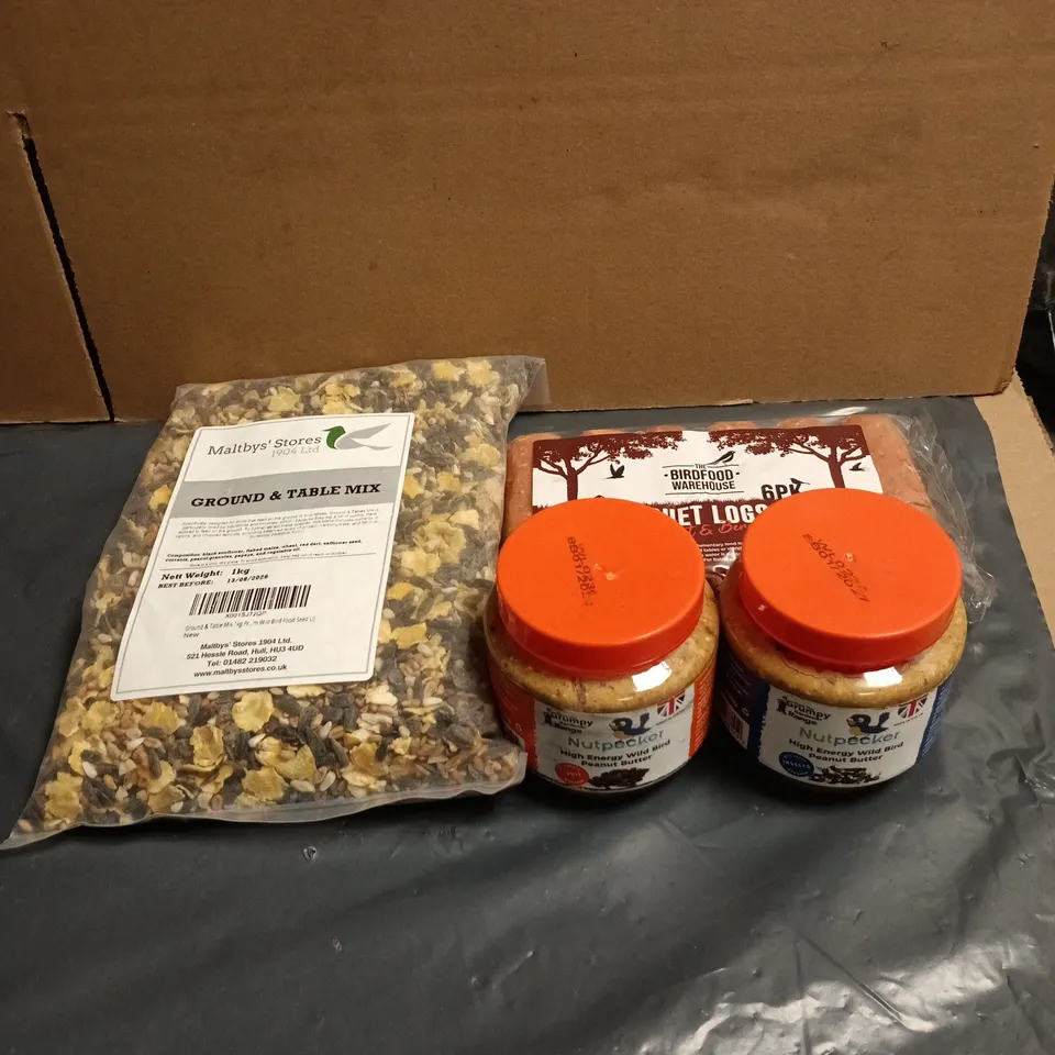TOTE OF APPROXIMATELY 10 ASSORTED BIRD FEED PRODUCTS TO INCLUDE SUET LOGS, GROUND AND TABLE MIX, NUT PECKER ETC