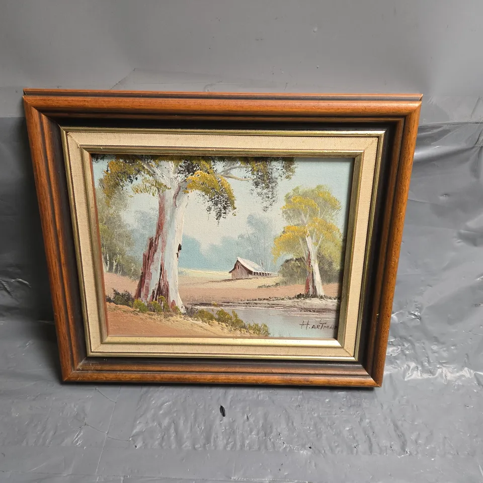 FRAMED LANDSCAPE PAINTING WITH TREES AND CABIN H.ARTMAN