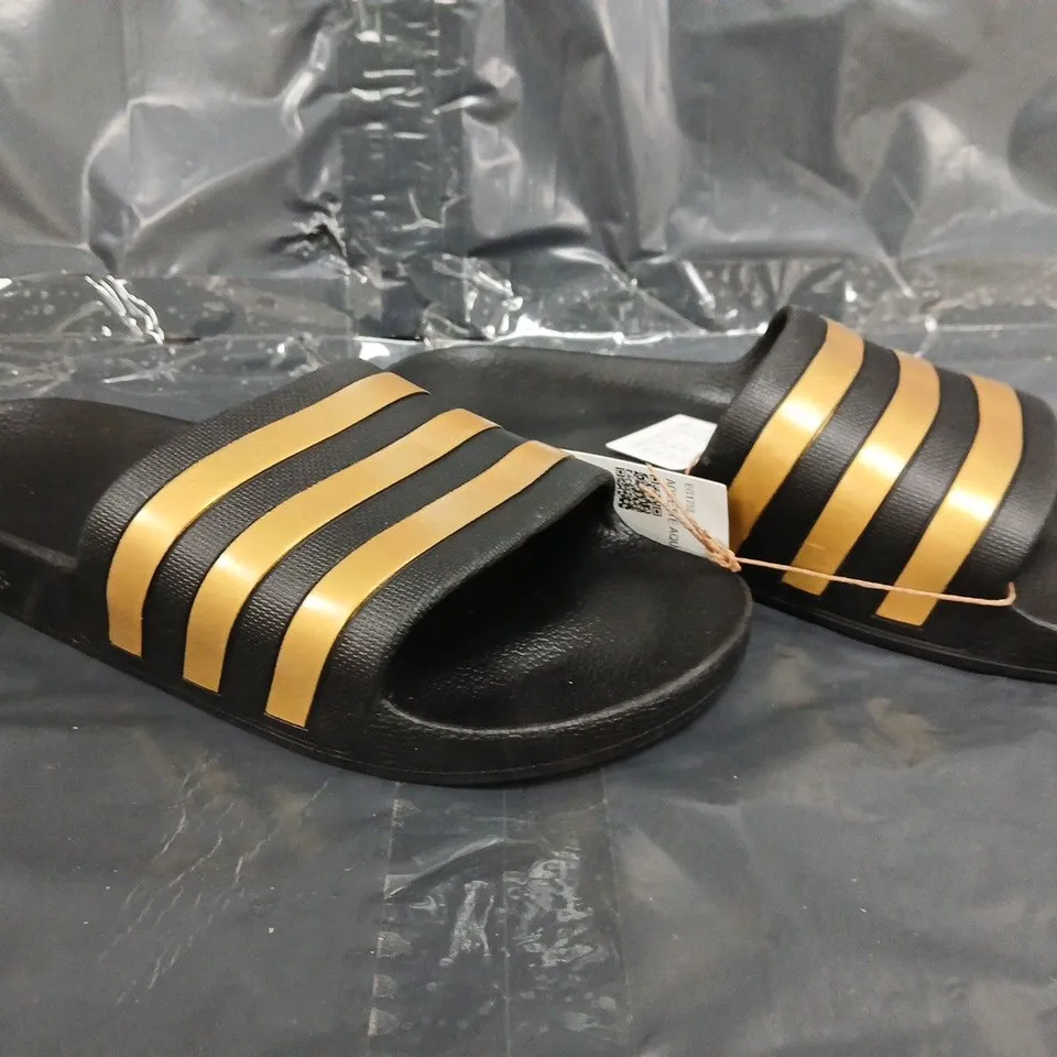 PAIR OF ADIDAS ADILETTE AQUA SLIDES IN BLACK/GOLD SIZE UK 9