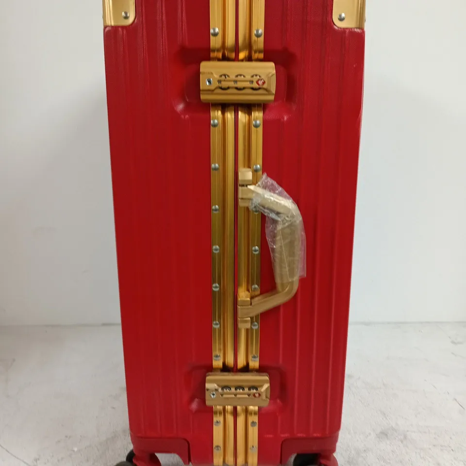 RED HARD-SHELL LUGGAGE SUITCASE WITH GOLD-TONE HARDWARE, WHEELED CARRY-ON