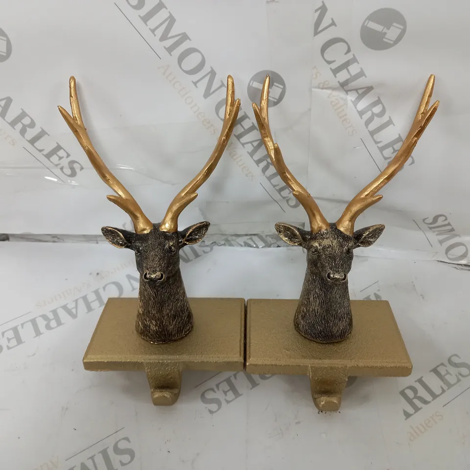 set of TWO ALISON CORK ANIMAL STOCKING HOLDERS STAG