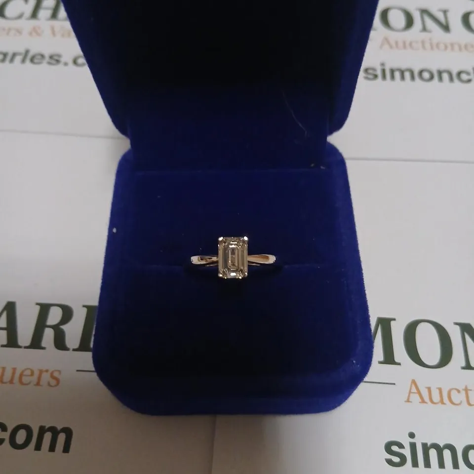 PLATINUM SOLITAIRE RING SET WITH A LAB GROWN EMERALD CUT DIAMOND WEIGHING +1.07CT