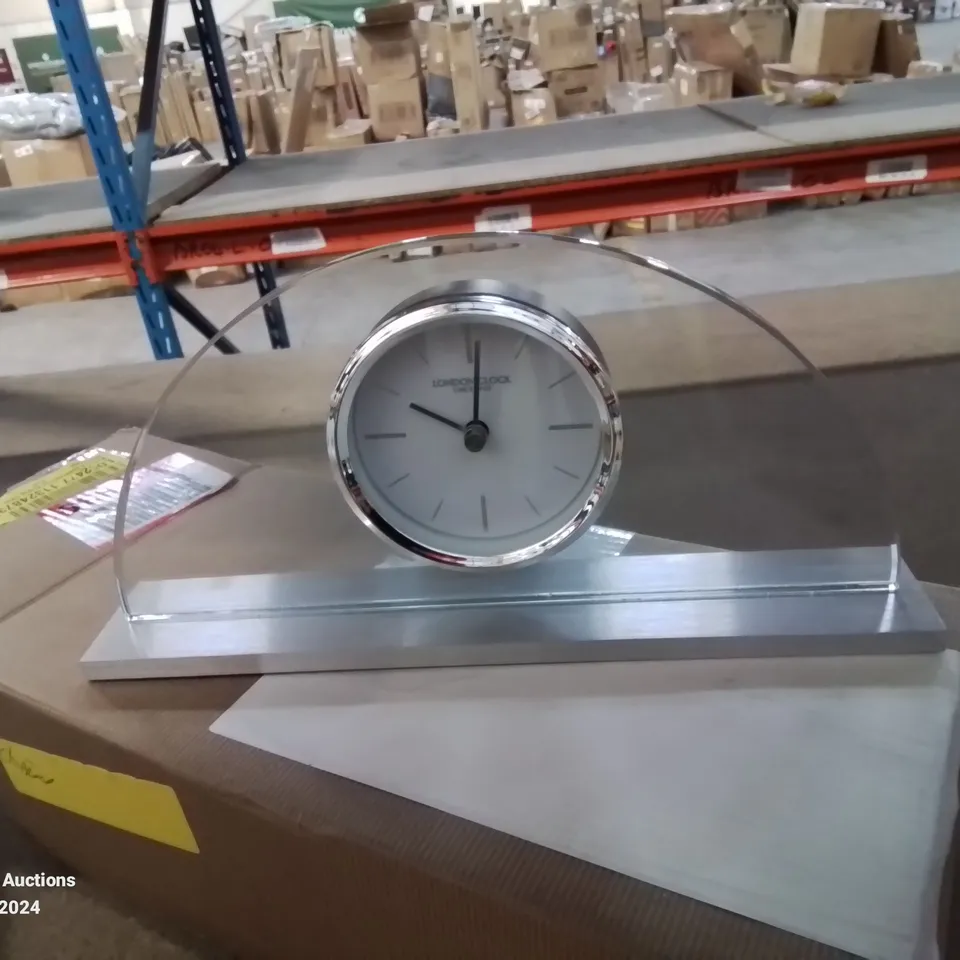 BOXED MODERN AND CONTEMPORARY ANALOG ELECTRIC CLOCK