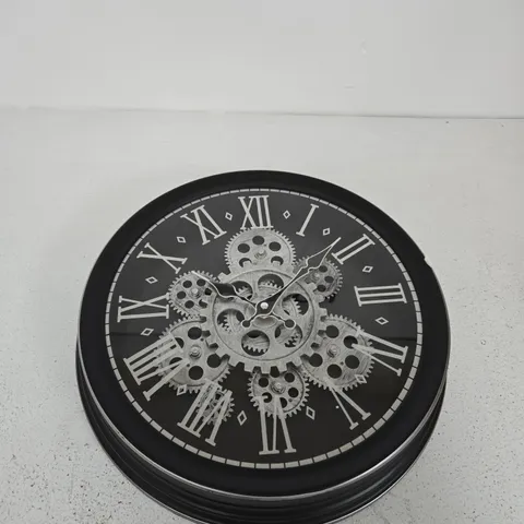 WALL CLOCK WITH EXPOSED GEAR MECHANISM – BLACK FRAME, ROMAN NUMERALS