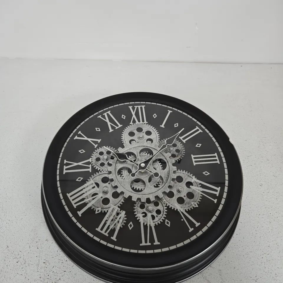 WALL CLOCK WITH EXPOSED GEAR MECHANISM – BLACK FRAME, ROMAN NUMERALS