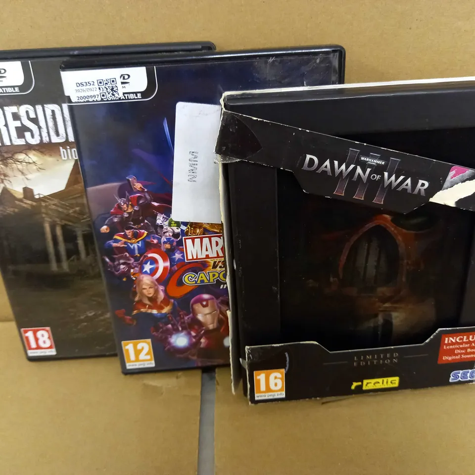 LOT OF 3 GAMES INCLUDING WARHAMMER DAWN OF WAR III LIMITED EDITION, MARVEL VS CAPCOM, RESIDENT EVIL VIII BIOHAZARD