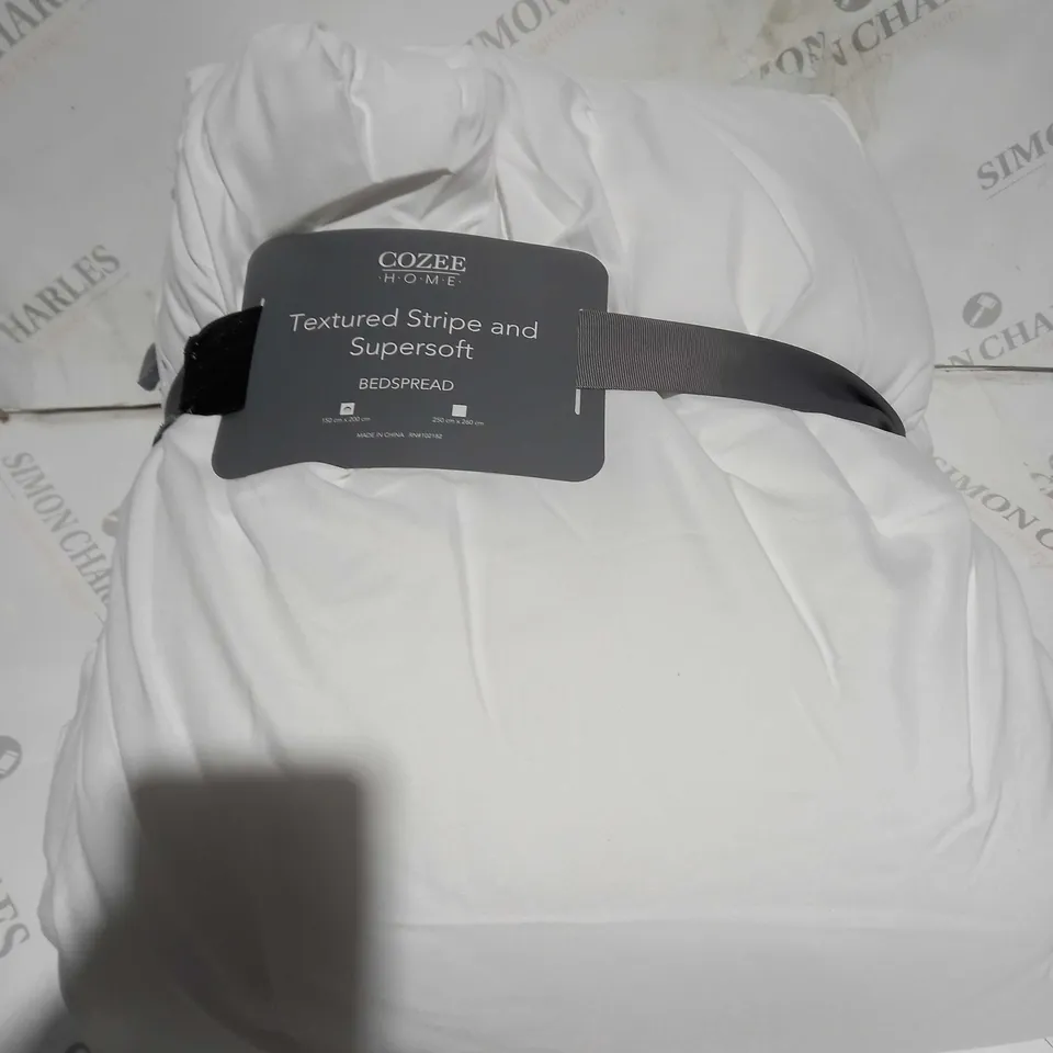 boxed COZEE HOME TEXTURED STRIPE AND SUPERSOFT BEDSPREAD - 250 BY 260CM 