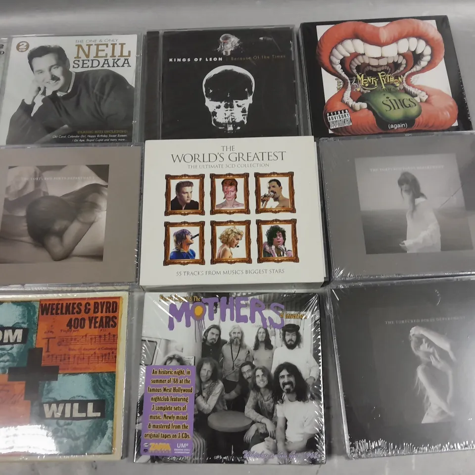 LOT OF APPROXIMATELY 40 ASSORTED MEDIA ITEMS TO INCLUDE MONTY PYTHON SINGS, THE WORLDS GRETEST 3CD SET AND KINGS OF LEON