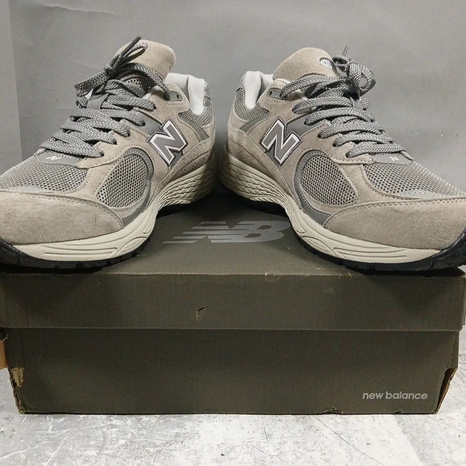 BOXED PAIR OF NEW BALANCE 2002R SHOES IN STONE/GREY SIZE UK 10.5