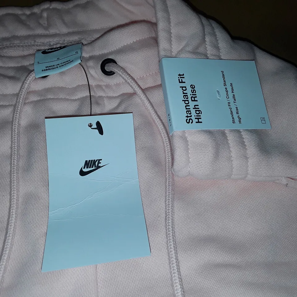 NIKE WOMEN'S PALE PINK SHORTS - L