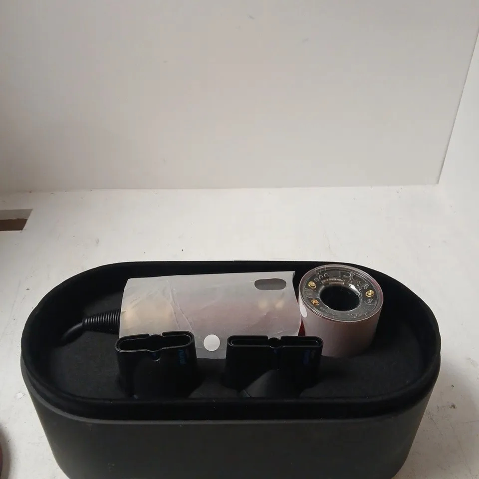 DYSON NURAL WITH OVAL BLACK STORAGE OTTOMAN WITH RED TRIM