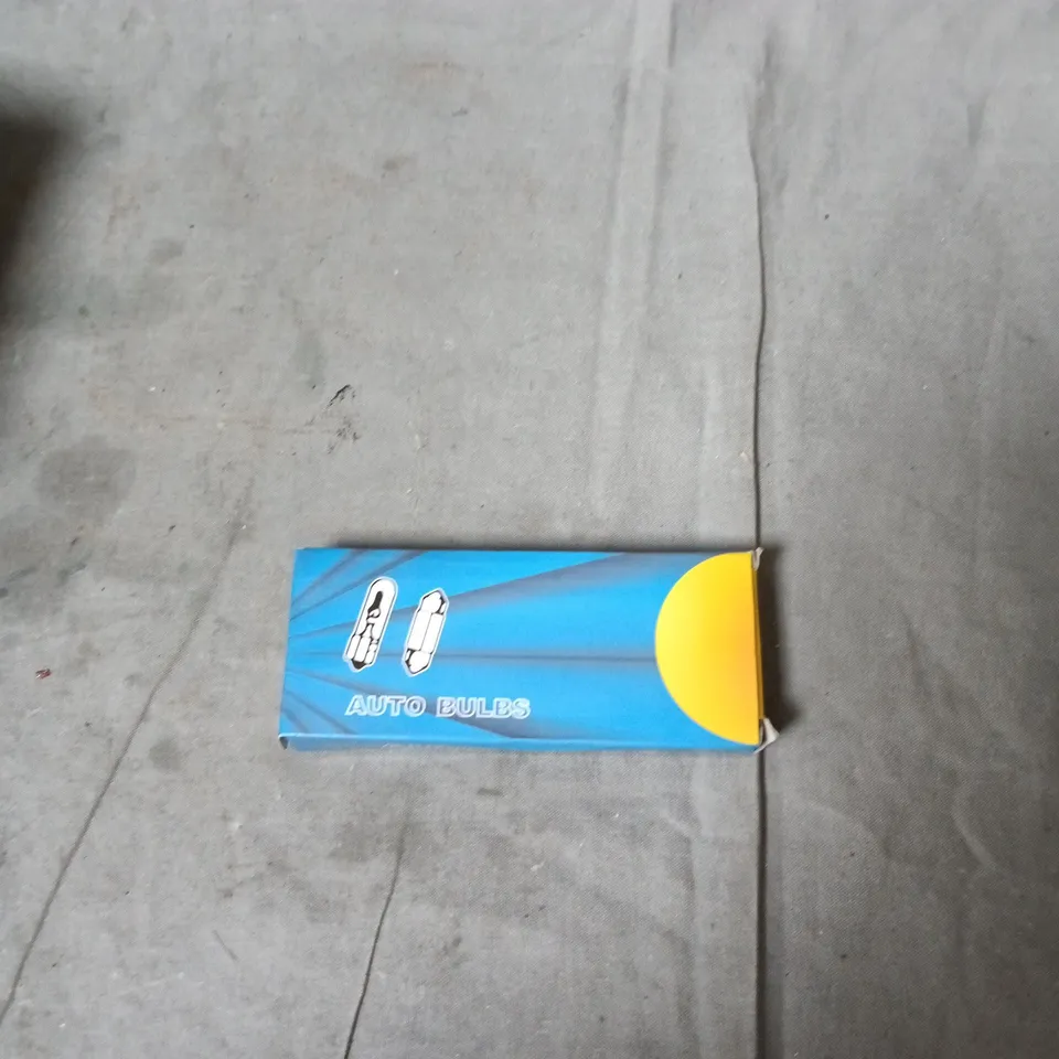 BOX OF APPROXIMATELY 12 ASSORTED AUTOMOTIVE ITEMS INCLUDING FORK OIL SEAL , CLIP ON GAS REGULATOR AND CAR BULBS