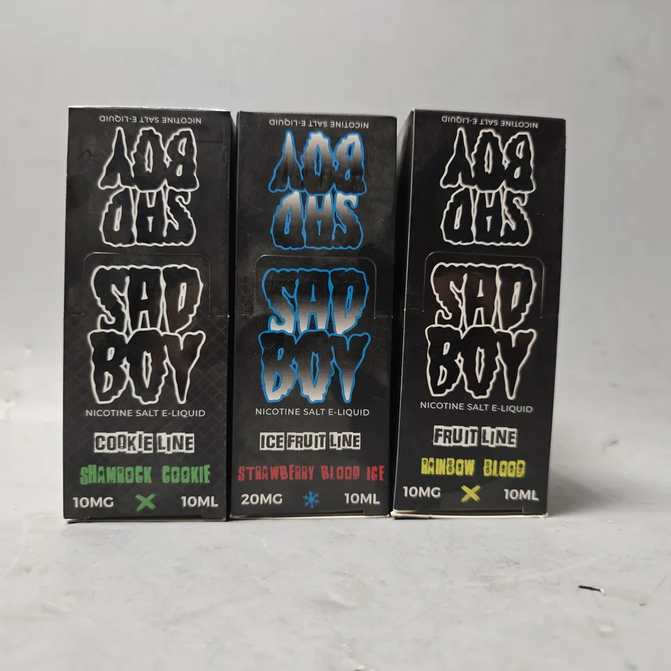 BOX OF APPROXIMATELY 15 ASSORTED SAD BOY E-LIQUID PRODUCTS TO INCLUDE - FRUIT LINE RAINBOW BLOOD , ICE FRUIT LINE STRAWBERRY BLOOD ICE , COOKIE LINE SHAMROCK COOKIE