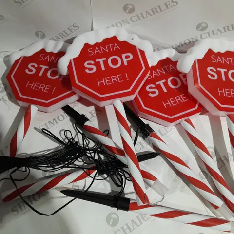 FESTIVE SET OF PRELIT SANTA STOP HERE STAKES
