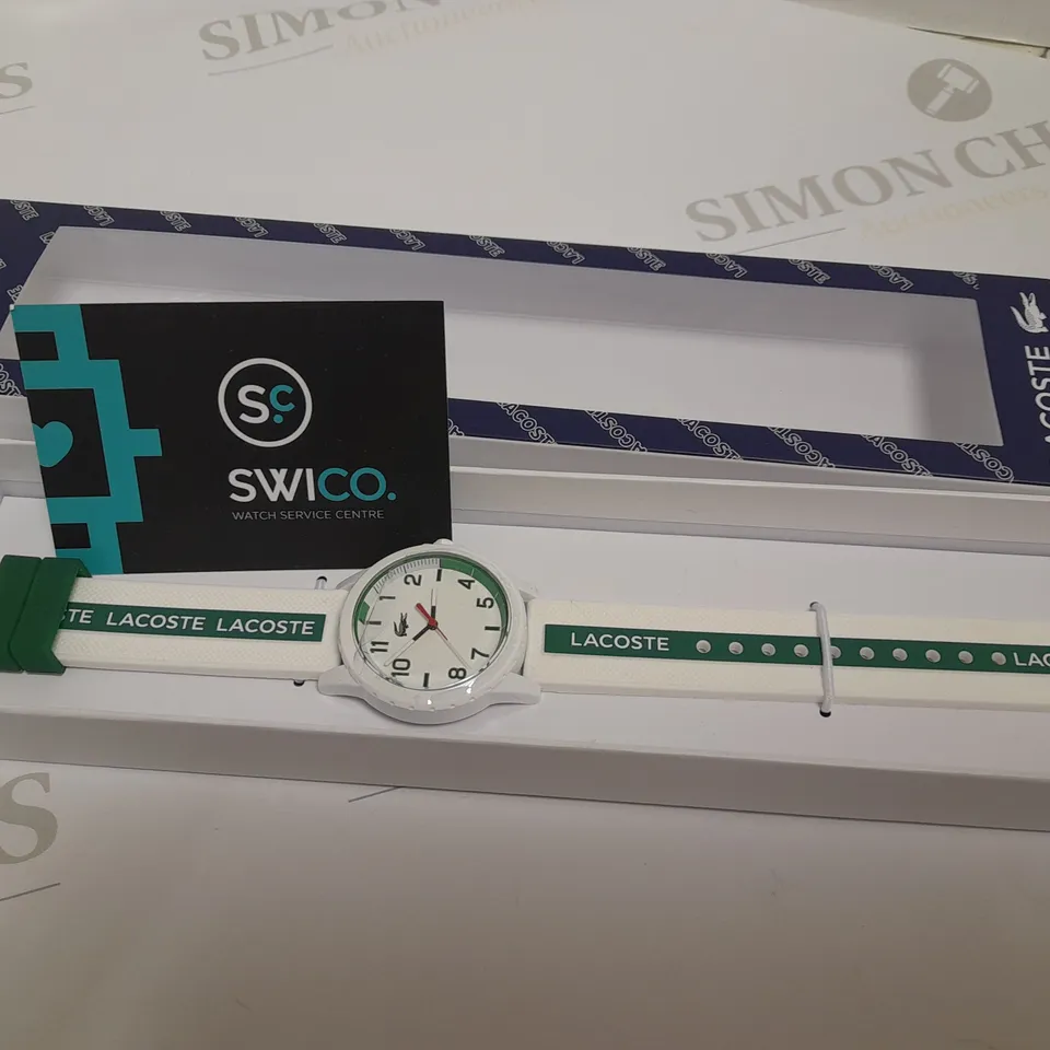 LACOSTE WHITE DIAL WATCH WITH WHITE AND GREEN STRAP DETAIL