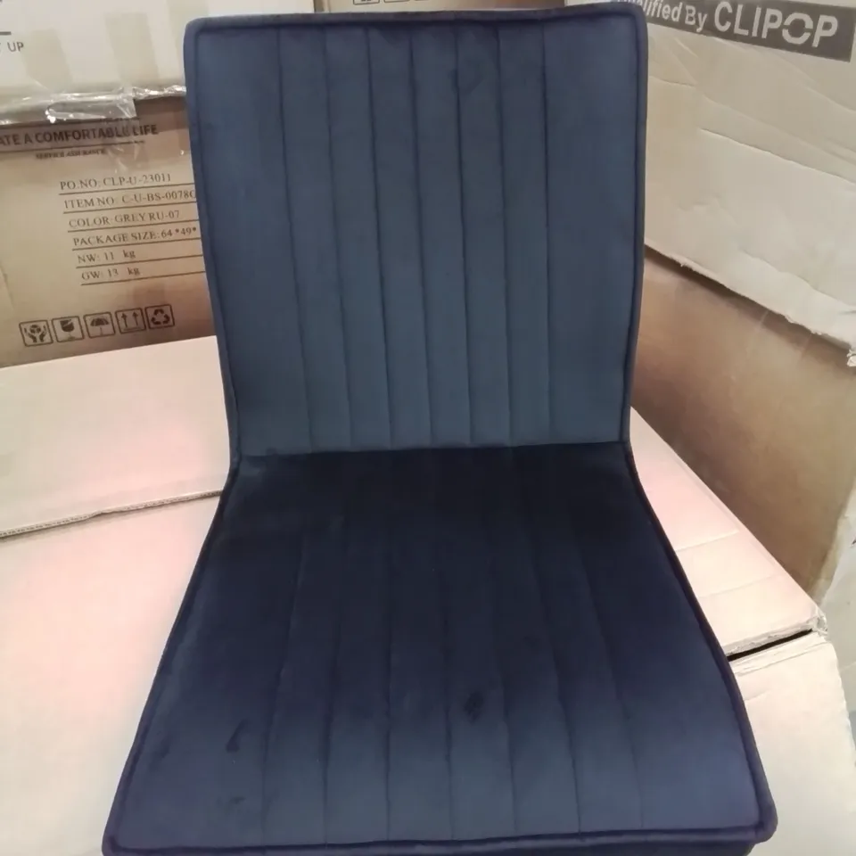 A BOXED SET OF 4 VELVET UPHOLSTERED DINING ROOM CHAIRS IN BLACK