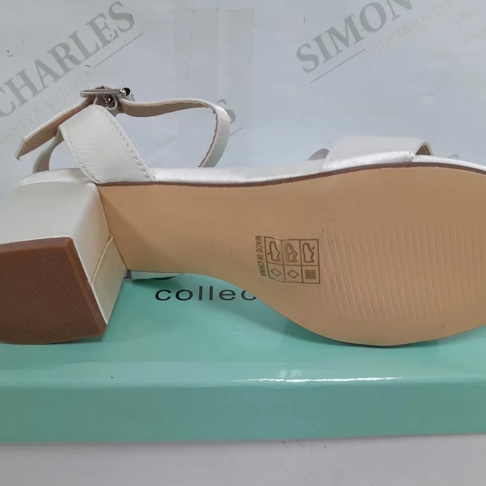 BOXED PAIR OF AJVANI COLLECTION HALLIE3 IVORY SATIN HEELS - UK 6