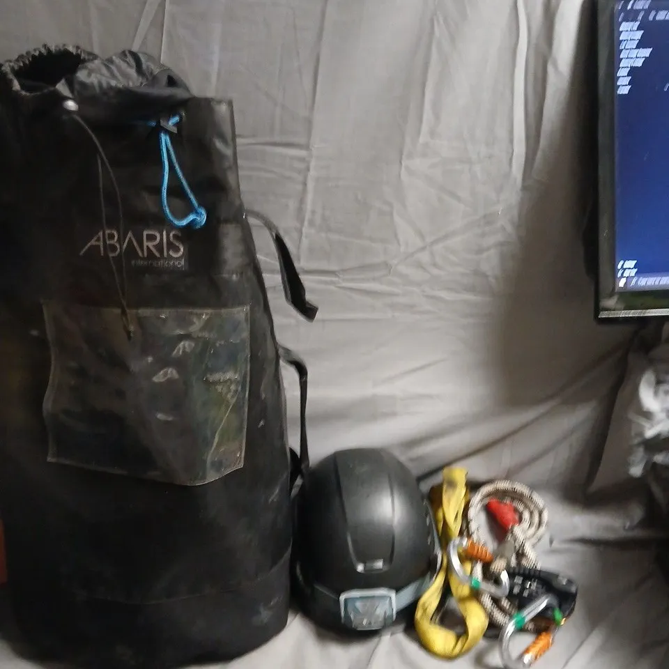 ABARIS INTERNATIONAL CYLINDRICAL TRAINING BAG WITH HELMET AND CLIMBING GEAR