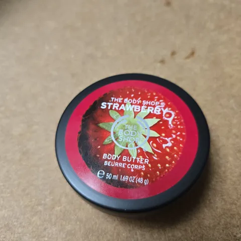 APPROXIMATELY 20 ASSORTED COSMETIC ITEMS INCLUDING THE BODY SHOP BODY BUTTER , BOOB TAPE AND NO 7 SHIMMER PALLETTE 