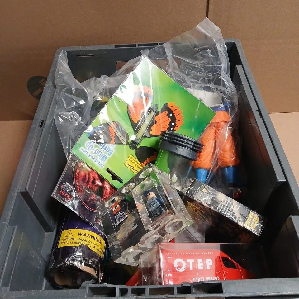 TOTE OF APPROXIMATELY 20 ASSORTED TOYS/RELATED ITEMS TO INCLUDE J-C PAD, LEGO JURASSIC WORLD TOY, STRANGERS THINGS TOY, ADTRUCKS OTEP RED VAN MODELS ETC