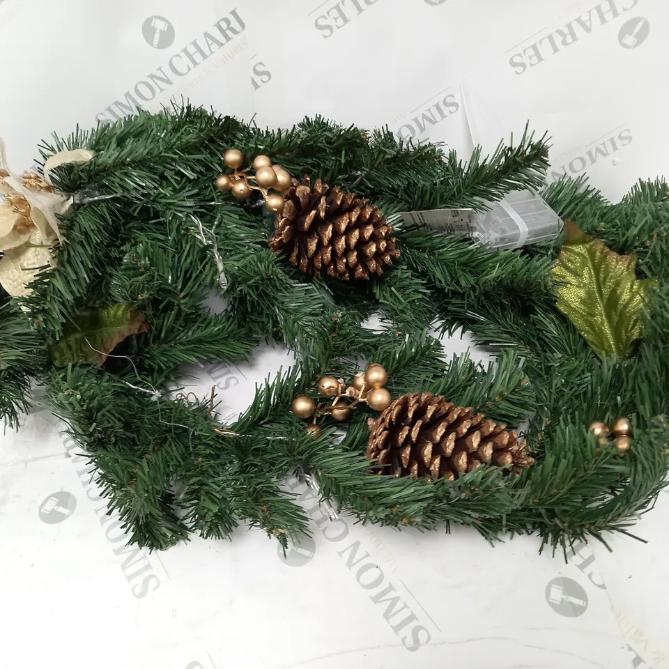 GOLD POINSETTA PRE LIT 6FT GARLAND RRP £19.99