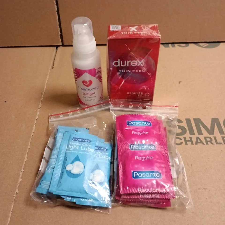 BOX OF APPROXIMATELY 10 PACKS OF ASSORTED CONDOMS AND LUBES TO INCLUDE DUREX, LOVE HONEY AND PASANTE