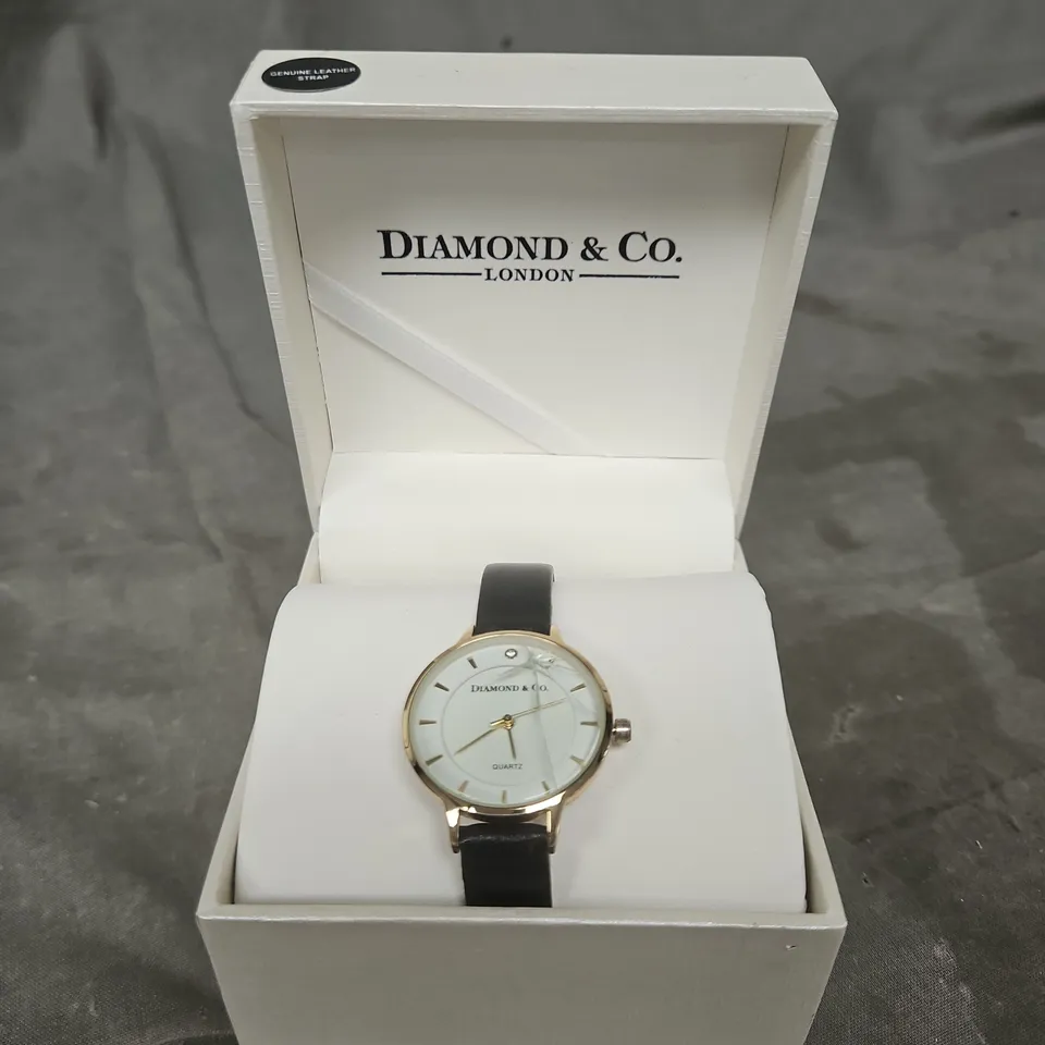 DIAMOND & CO. GOLD-TONE WRISTWATCH WITH WHITE DIAL, BLACK LEATHER STRAP