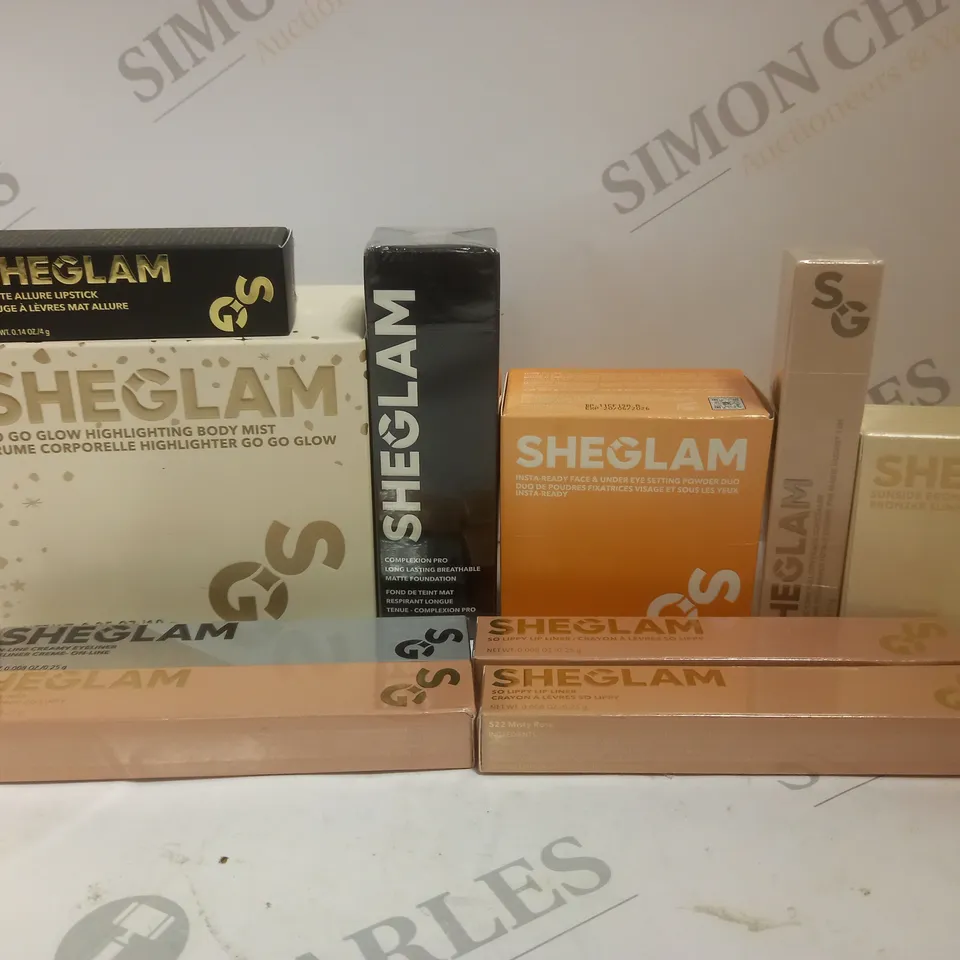 BOX OF APPROX 10 ASSORTED SHEGLAM BEAUTY PRODUCTS TO INCLUDE HIGHLIGHTING BODY MIST, COMPLEXION PRO FOUNDATION, SUNSIDE BRONZER, ETC 