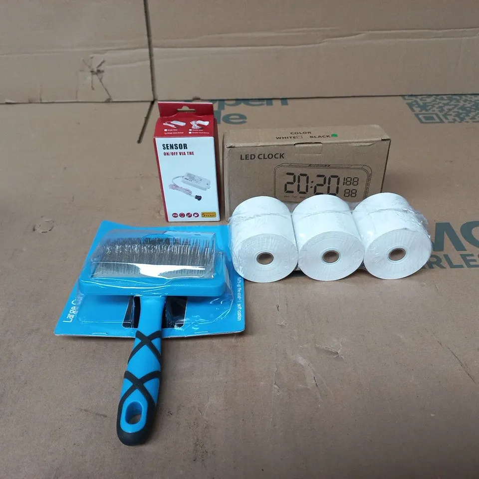 TOTE OF APPROXIMATELY 15 ASSORTED ITEMS TO INCLUDE LED CLOCK, ON/OFF SENSOR, TILL RECEIPT ROLLS, PET GROOMING TOOL ETC