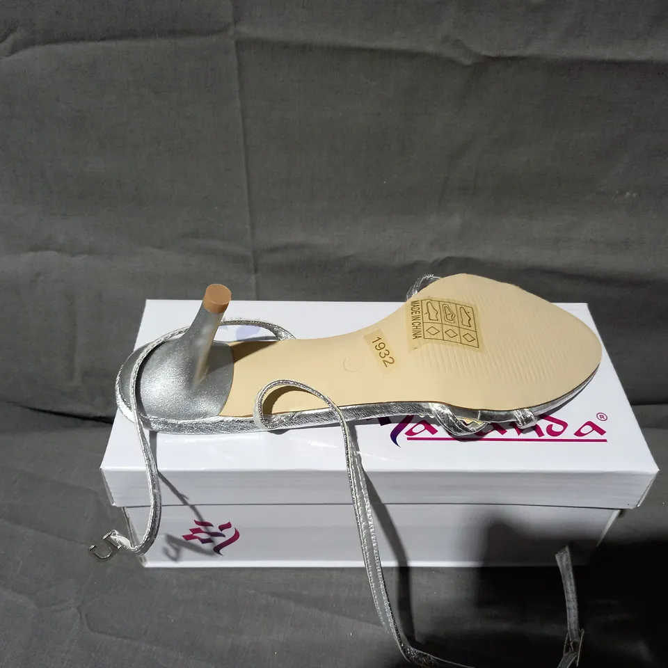 APPROXIMATELY 24 BOXED PAIRS OF LAVANDA STRAP SANDALS IN SILVER VARIOUS SIZES TO INCLUDE SIZES 37, 38, 39