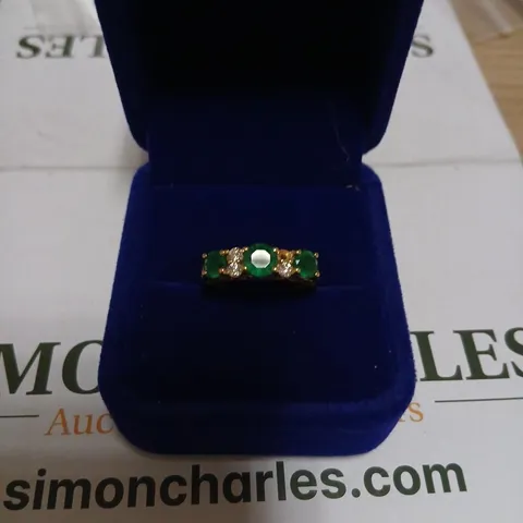 GOLD-TONE RING WITH GREEN STONES AND CLEAR ACCENTS