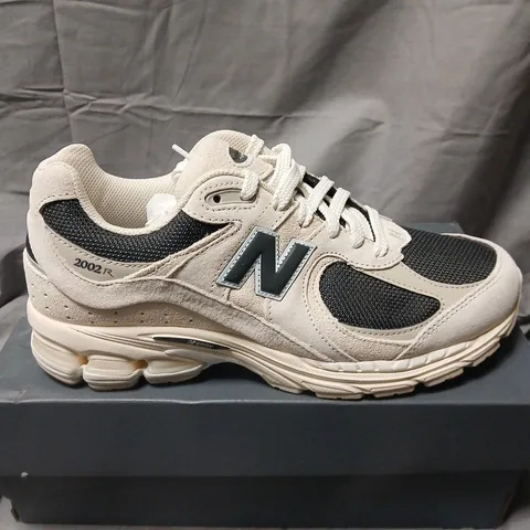 BOXED NEW BALANCE U2002RN SNEAKERS – UK 9, CREAM/BLACK