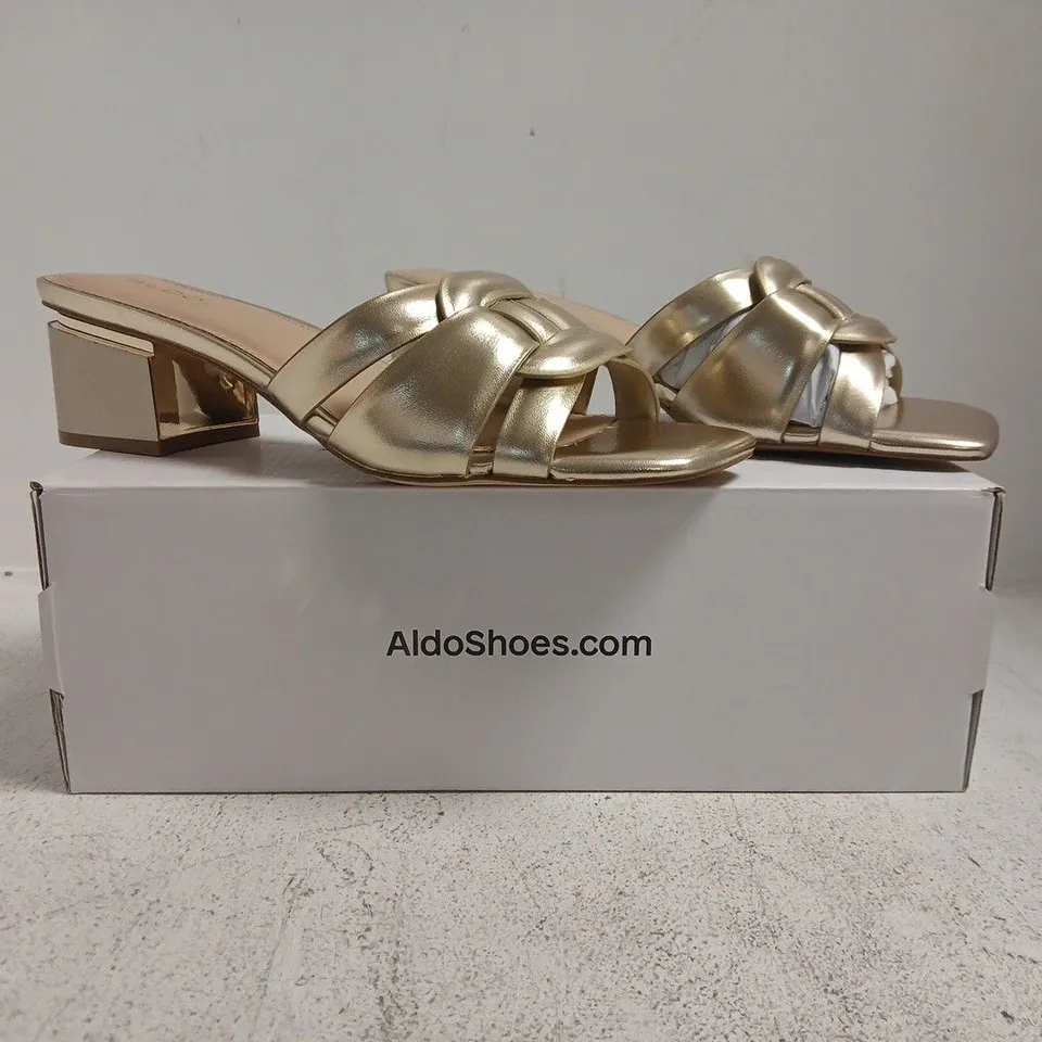 BOXED PAIR OF ALDO OPEN TOE LOW BLOCK HEEL SANDALS IN METALLIC GOLD SIZE UK 7