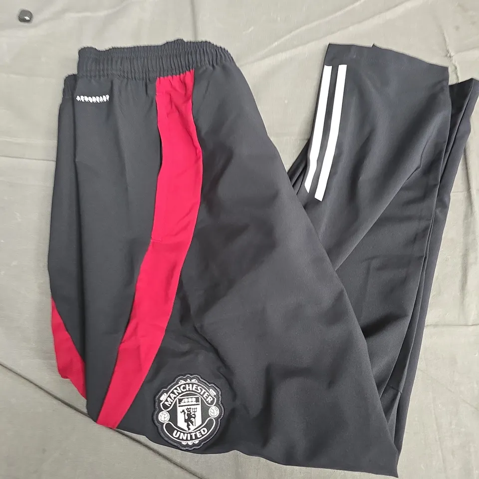 MANCHESTER UNITED ADIDAS TRACK PANTS – BLACK WITH RED STRIPE, MEN'S SIZE M