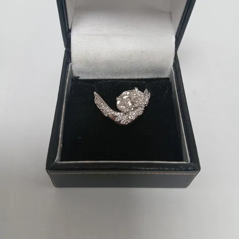 9CT WHITE GOLD TWIST RING SET WITH A LAB GROWN OVAL CUT DIAMOND AND PAVE BAND WEIGHING +1.77CT