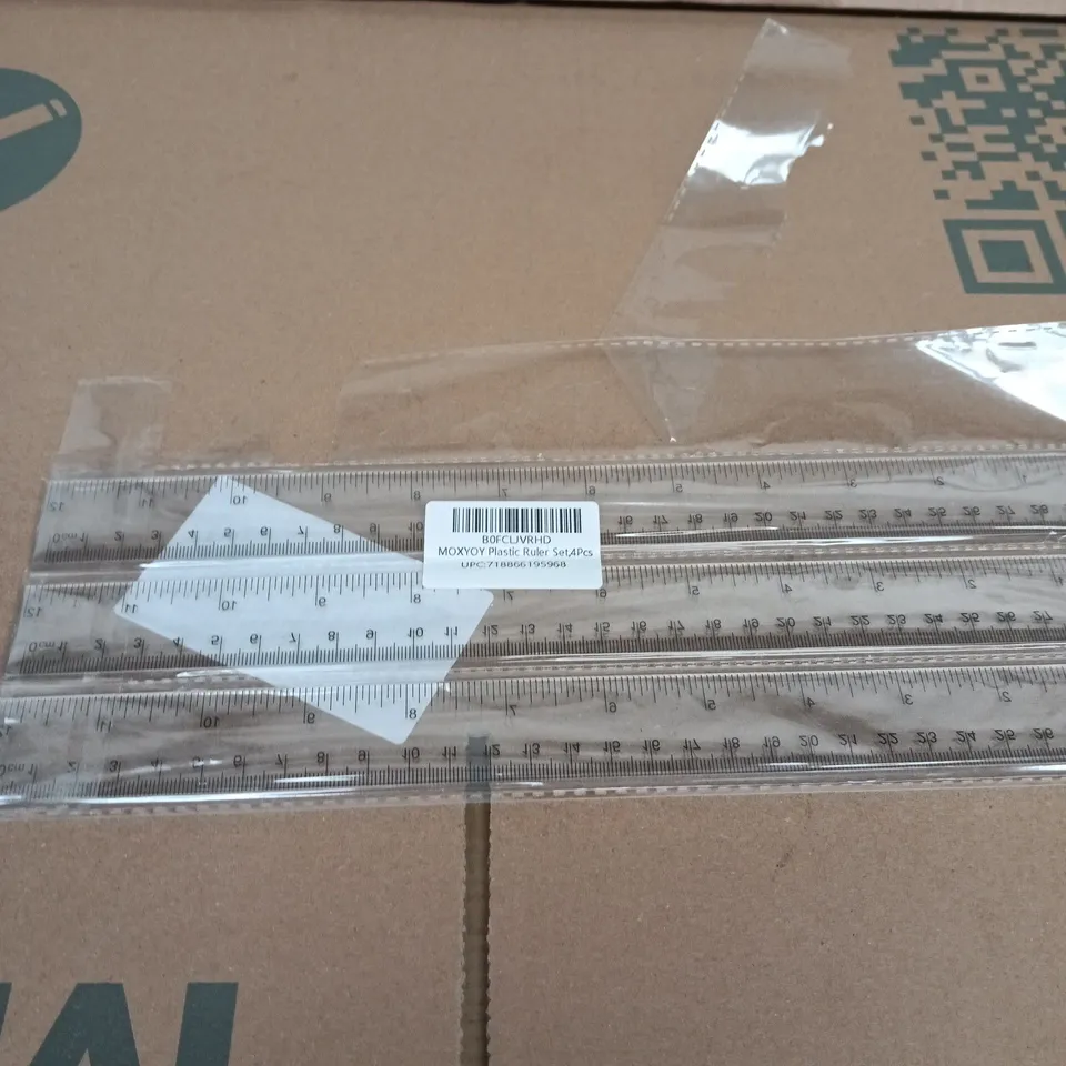 BOX OF APPROXIMATELY 10 ASSORTED GOODS INCLUDING PLASTIC RULERS, DRINKING STRAWS AND A DOOR HANDLE