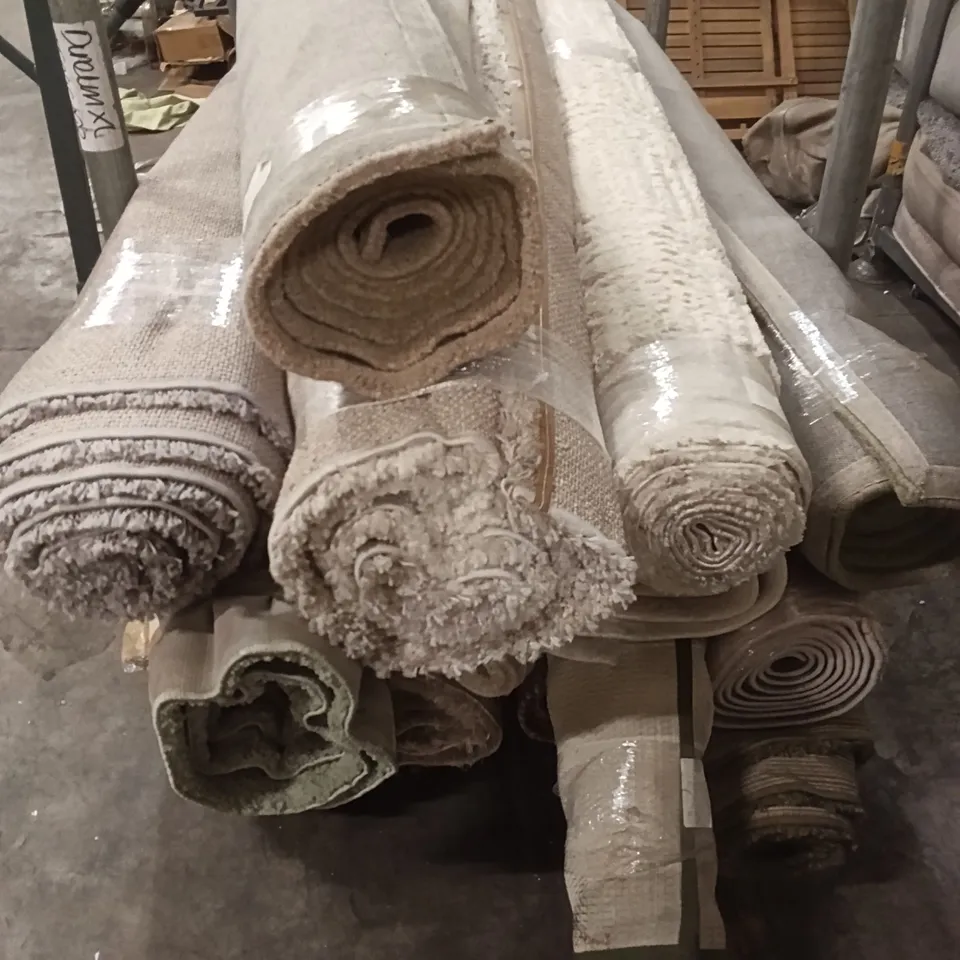STILLAGE OF DESIGNER RUGS APPROXIMATELY 15 LARGE RUGS