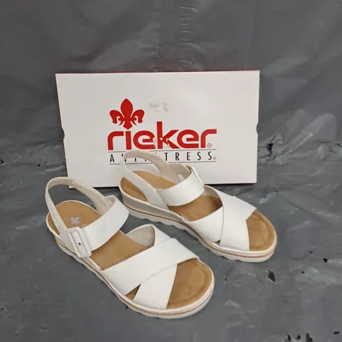 BOXED PAIR OF RIEKER WHITE MULTI STRAP SANDAL SIZE 41