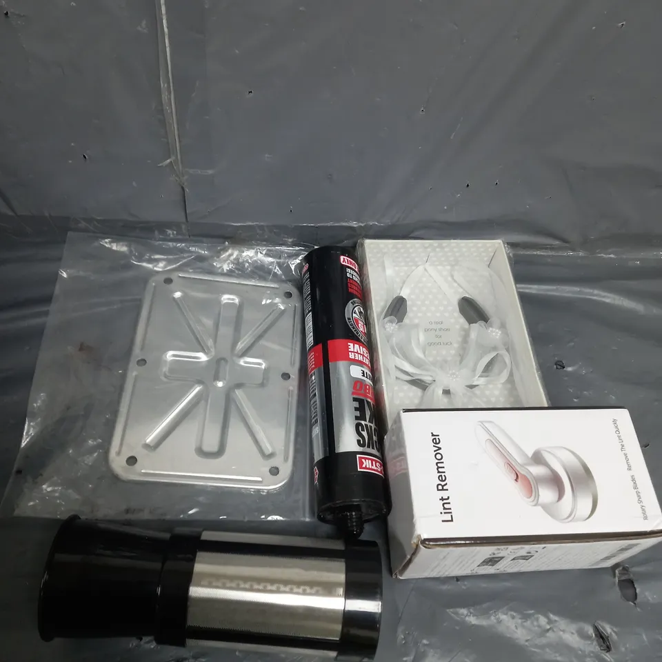 APPROXIMATELY 10 ASSORTED HOUSEHOLD ITEMS TOO INCLUDE , LINT REMOVER , PONY SHOE , ADHESIVE , ETC
