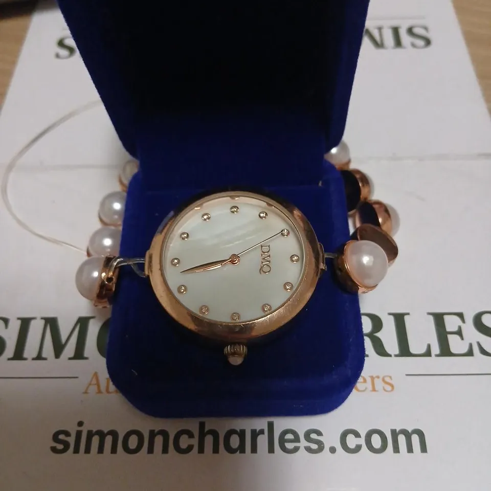 DIAMONIQUE 0.07CT TW SIMULATED PEARL STRAP WATCH 