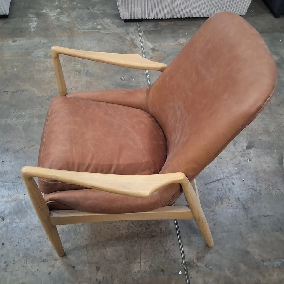 UNBOXED CARRERA ARMCHAIR IN BROWN
