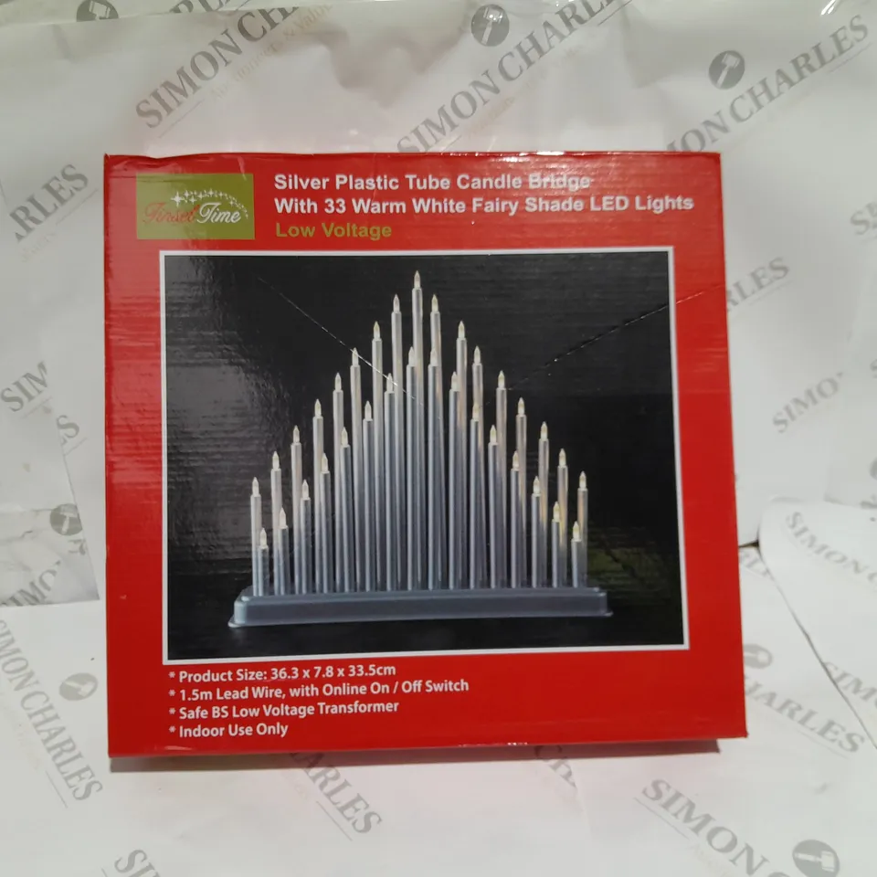 SILVER PLASTIC TUBE CANDLE BRIDGE WITH 33 WARM WHITE FAIRY SHADE LED LIGHTS