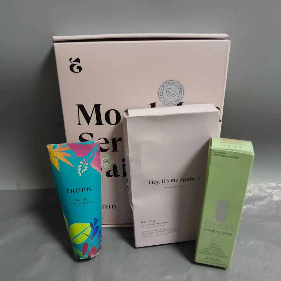 LOT OF APPROXIMATELY 3 ASSORTED COSMETIC ITEMS TO INCLUDE - ESTRID VEGAN STARTER RAZER KIT - CLINIQUE MOISTURE SURGE CC CREAM - TROPIC REPAIRING FOOT REMEDY