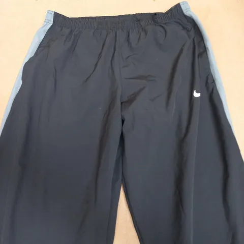NIKE DRI-FIT TRACK PANTS – NAVY WITH LIGHT BLUE SIDE STRIPES SIZE L