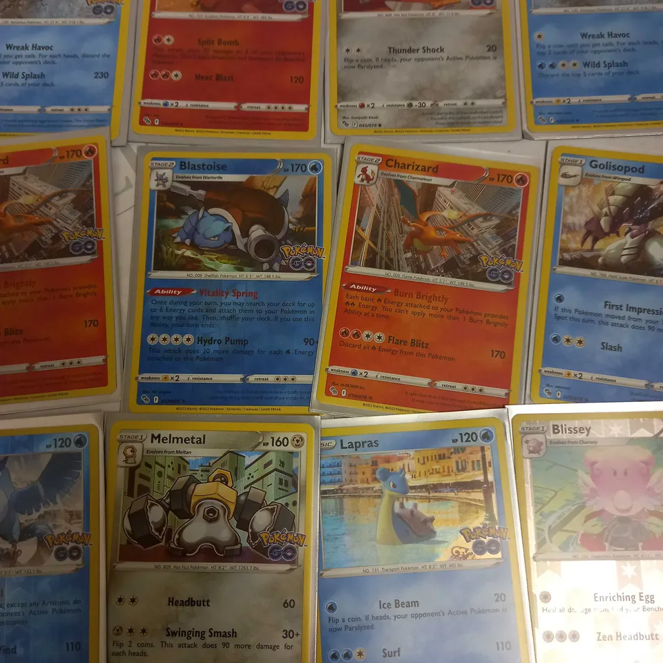 LOT OF 24 ASSORTED POKEMON CARDS