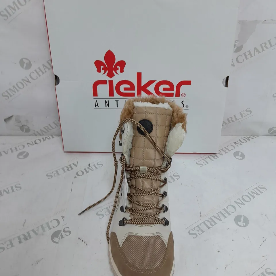 BOXED PAIR OF RIEKER CREAM WINTER FUR HIKE BOOTS IN SIZE 6