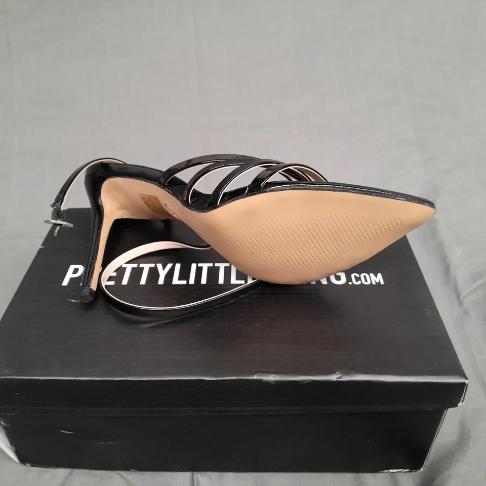 BOXED PAIR OF PRETTYLITTLETHINGS BLACK WIDE FIT POINT TOE STRAPPY STILETTO HEELS SIZE 7 
